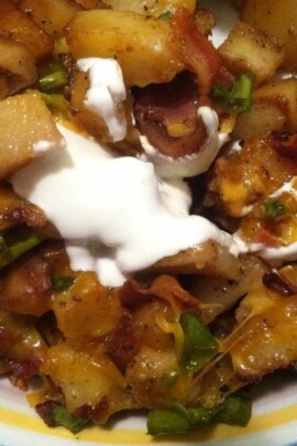 close up picture of potato casserole with bacon, cheese and sour cream