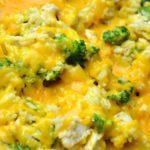 chicken, broccoli and rice with melted cheese