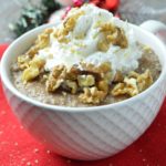 gingerbread oatmeal in a bowl with whipped cream