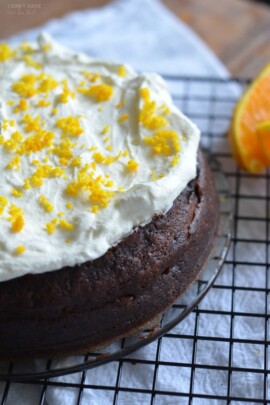 orange chocolate cake with icing and orange zest on top