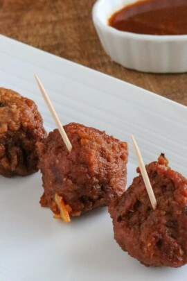 meatballs with a toothpick in them on a plate