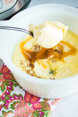 egg custard on a spoon with the rest of the custard in the background
