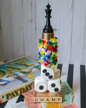 trophy with game pieces attached