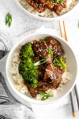 an overhead photo of Mongolian Beef in a bowl with rice and broccoli