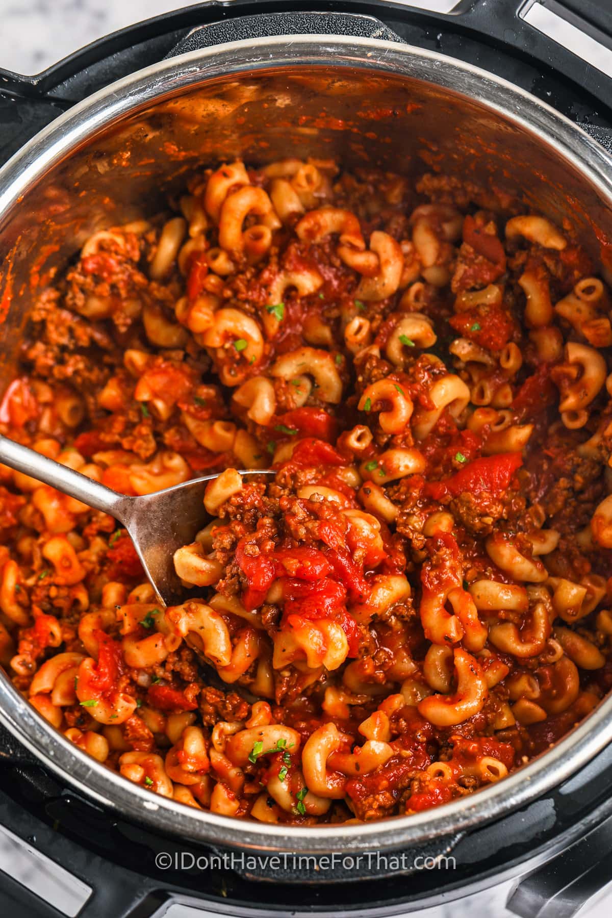 cooked Instant Pot Goulash with a spoon