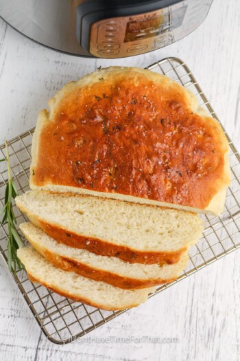 cutting Instant Pot Rosemary Bread into slices