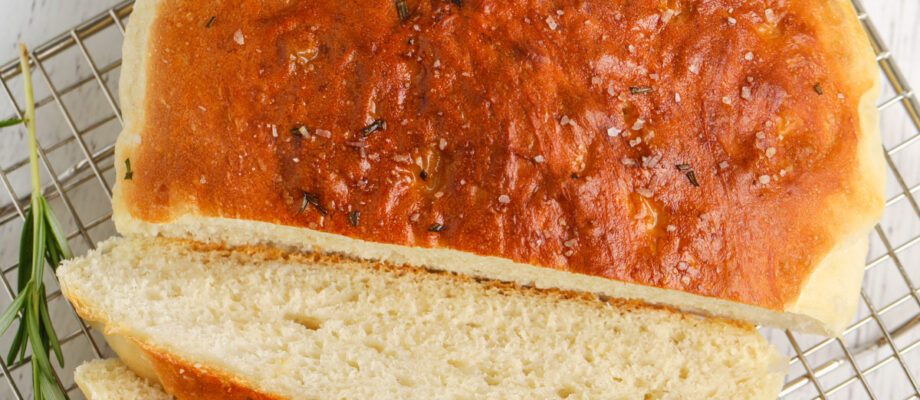 cutting Instant Pot Rosemary Bread into slices