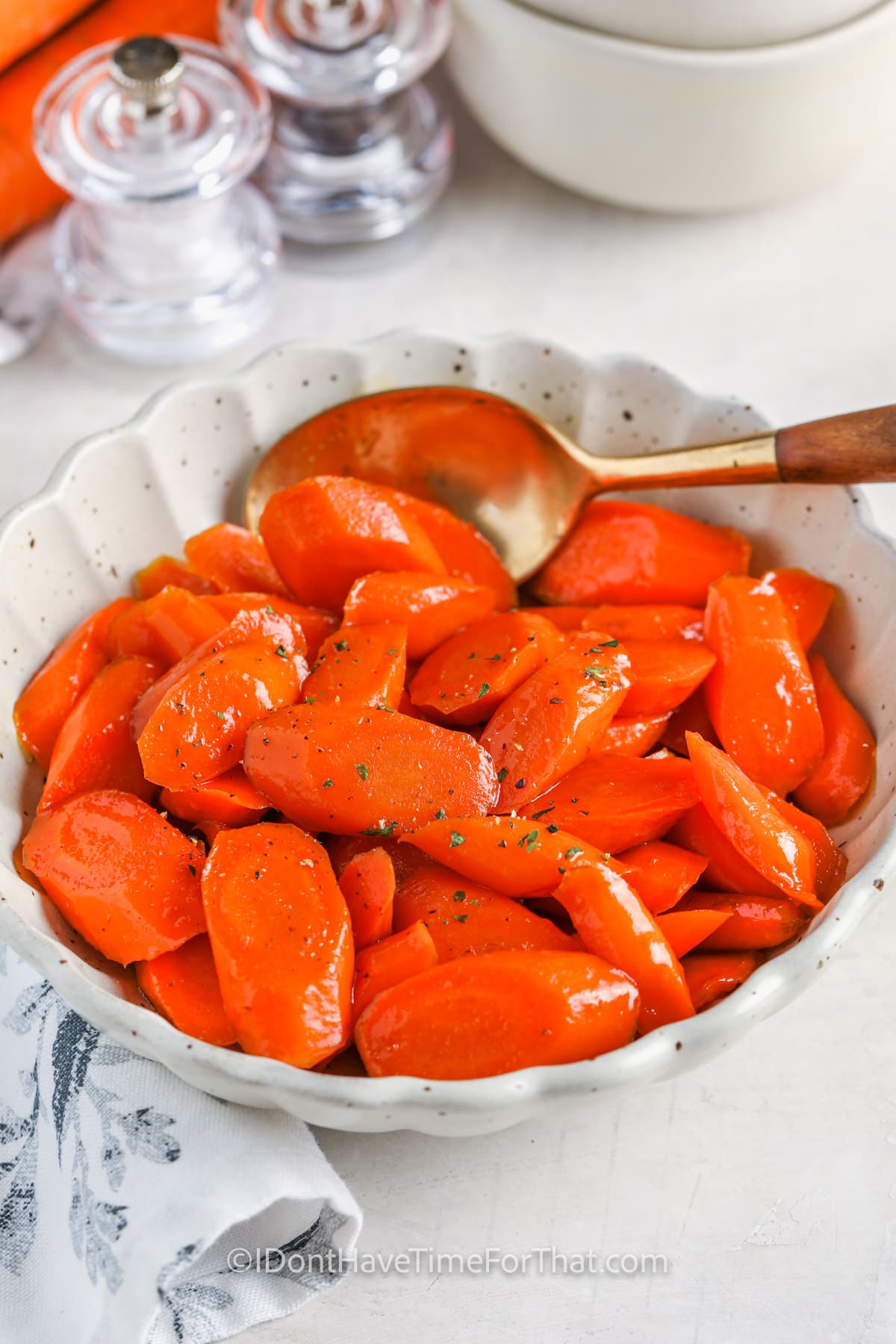 cooked Maple Glazed Carrots in a bowl with a spoon