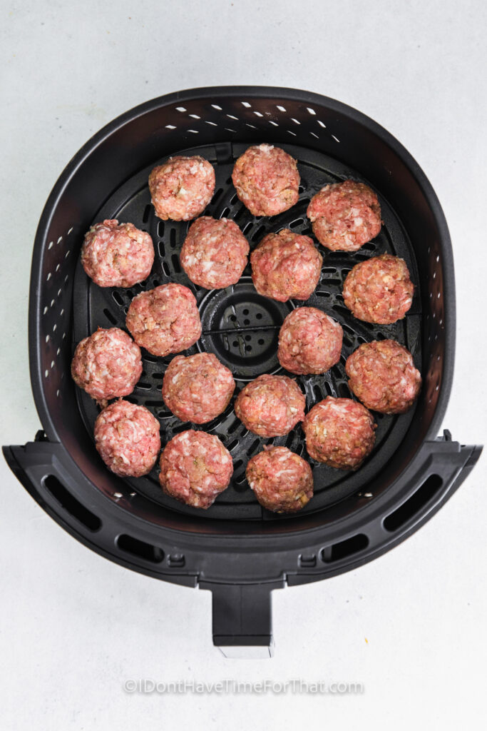 adding Air Fryer Meatballs to the fryer
