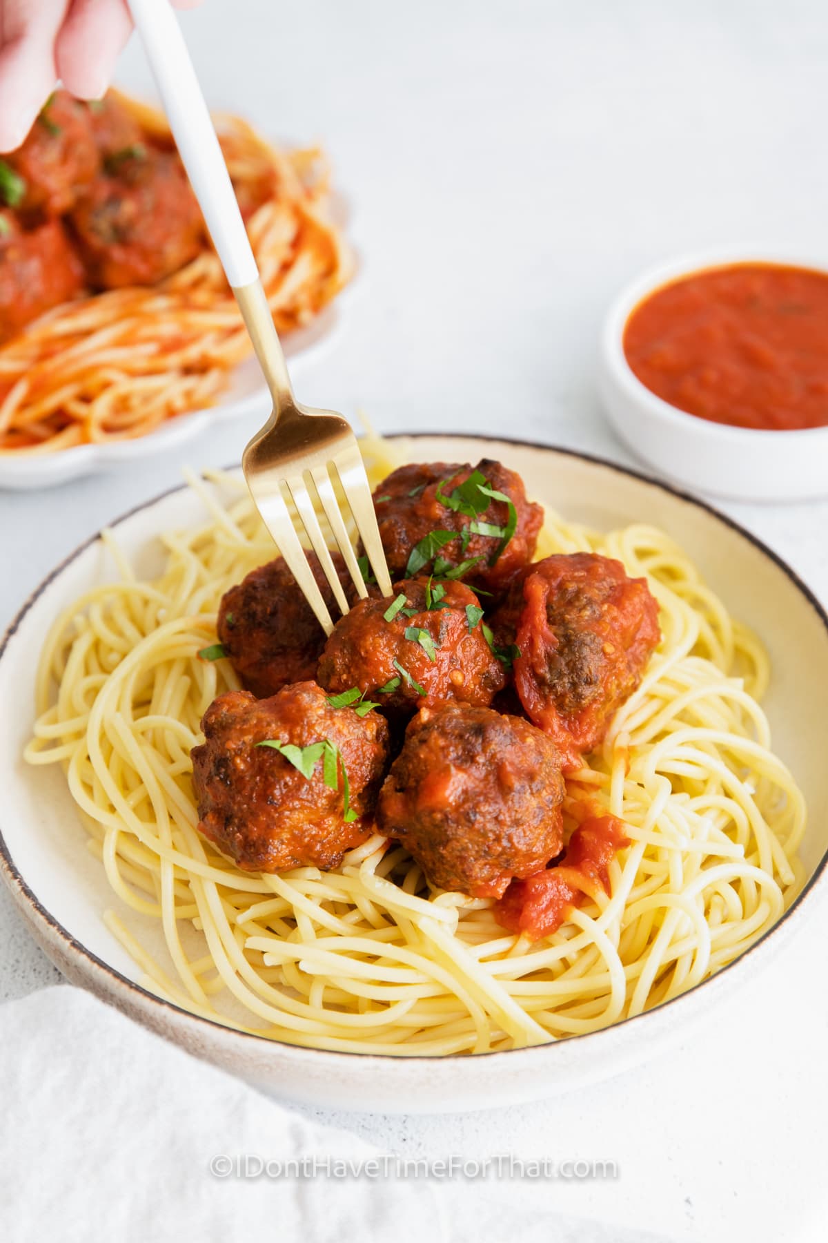 Air Fryer Meatballs in a bowl with a fork