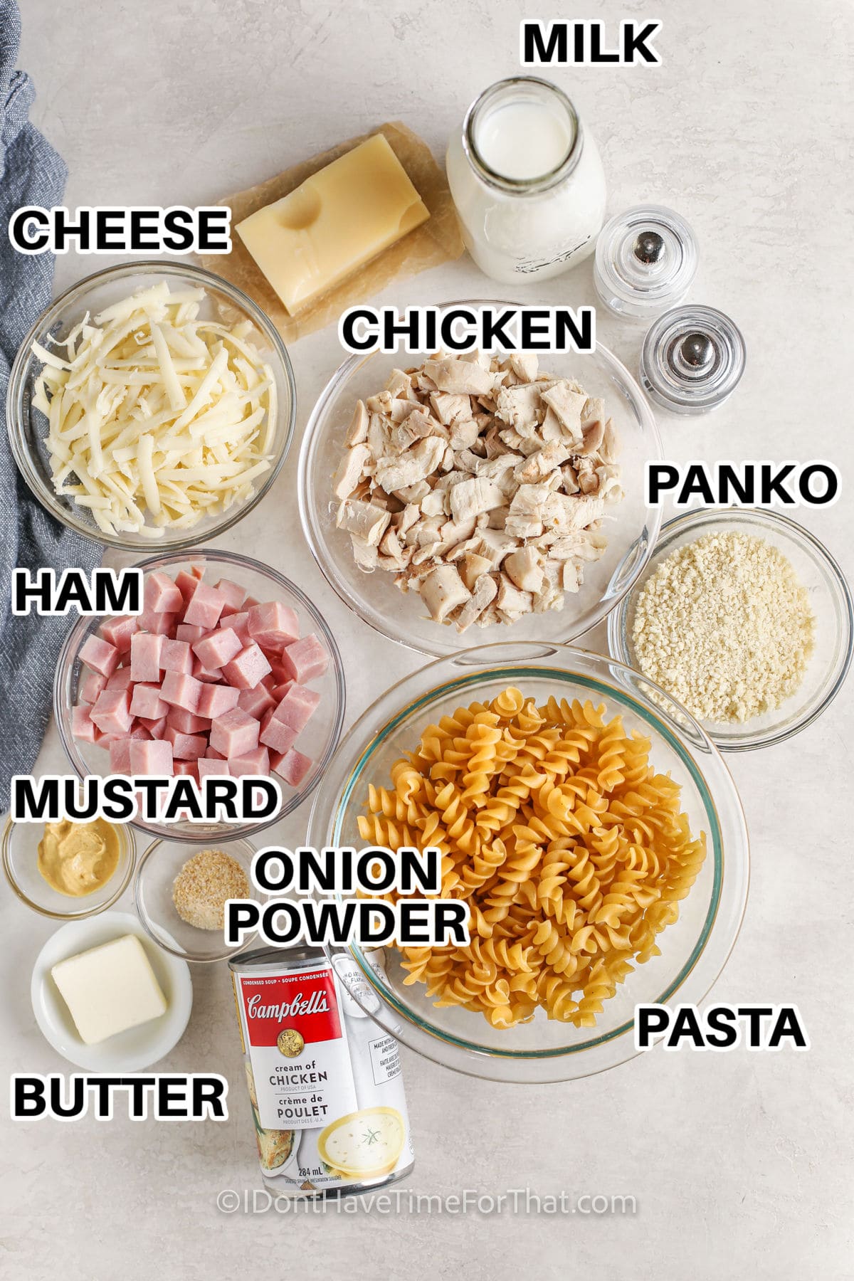 cheese , chicken , milk , panko breadcrumbs , rotini pasta , onion powder , butter , dijon mustard , ham and cream of chicken soup with labels to make 15 Minute Chicken Cordon Bleu Casserole