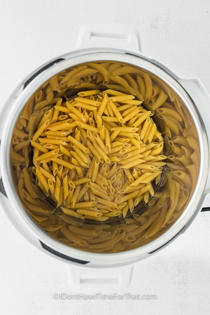 noodles in pot to make Instant Pot Feta Pasta