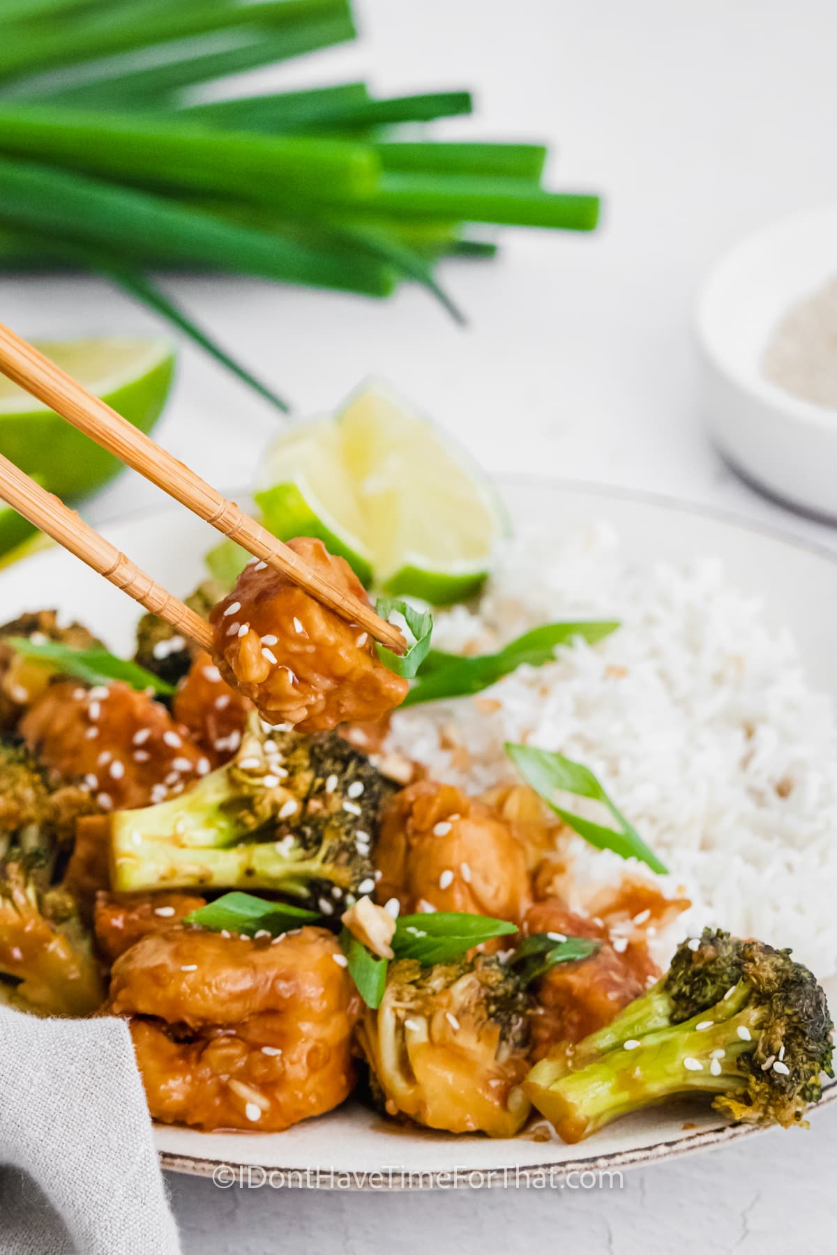 plated Instant Pot Sesame Chicken Bowls with chop sticks