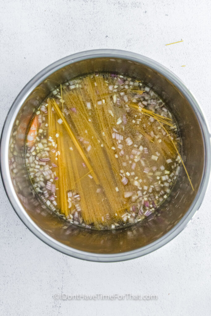 ingredients in a pot to make Instant Pot Shrimp Scampi
