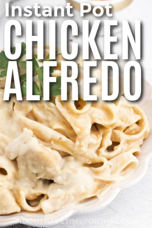 creamy Instant Pot Chicken Alfredo on a plate with writing