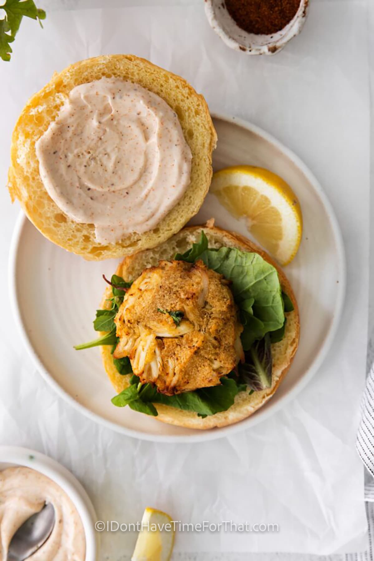 plated Air Fryer Crab Cakes on lettuce and a bun