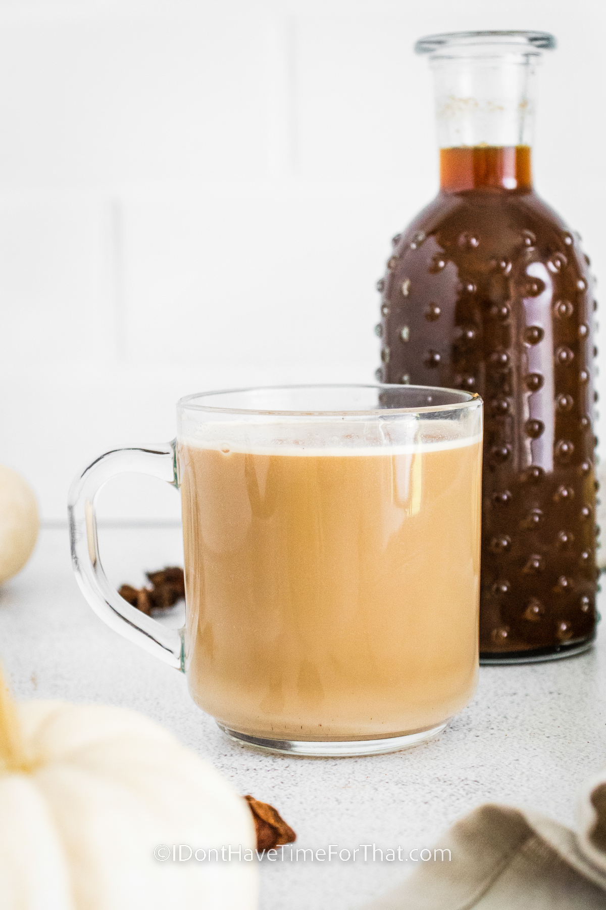 cup of Pumpkin Spice Latte Recipe with jar full in the back