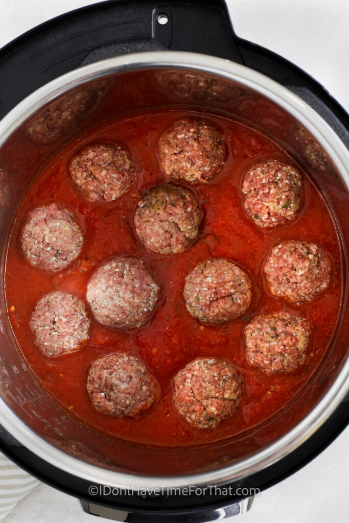 meatballs cooking in marinara sauce in an Instant Pot