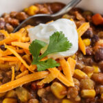 Instant Pot Vegetarian Chili with cheese and sour cream on top