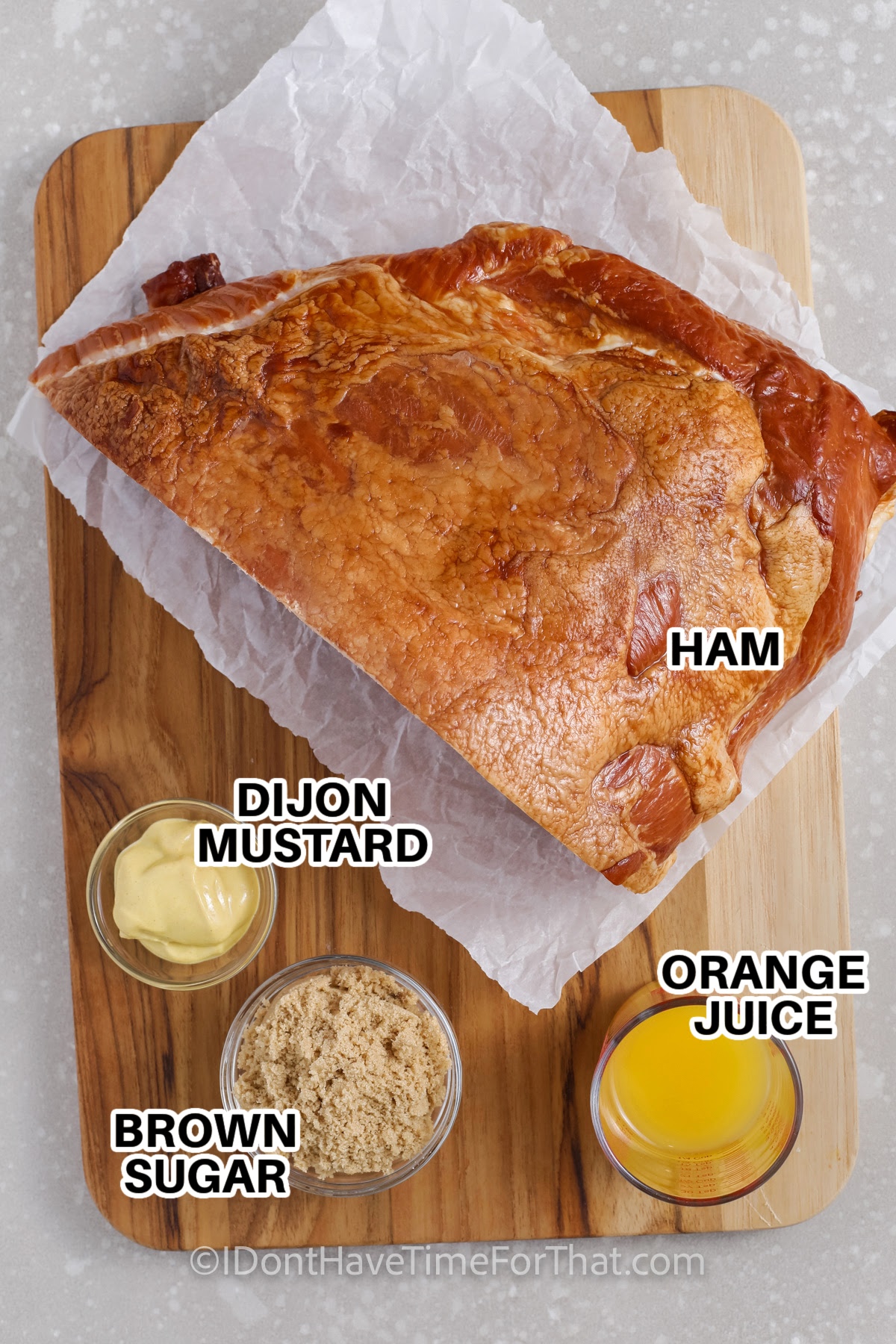 ingredients to make Instant Pot Ham labeled: ham, dijon mustard, orange juice, brown sugar